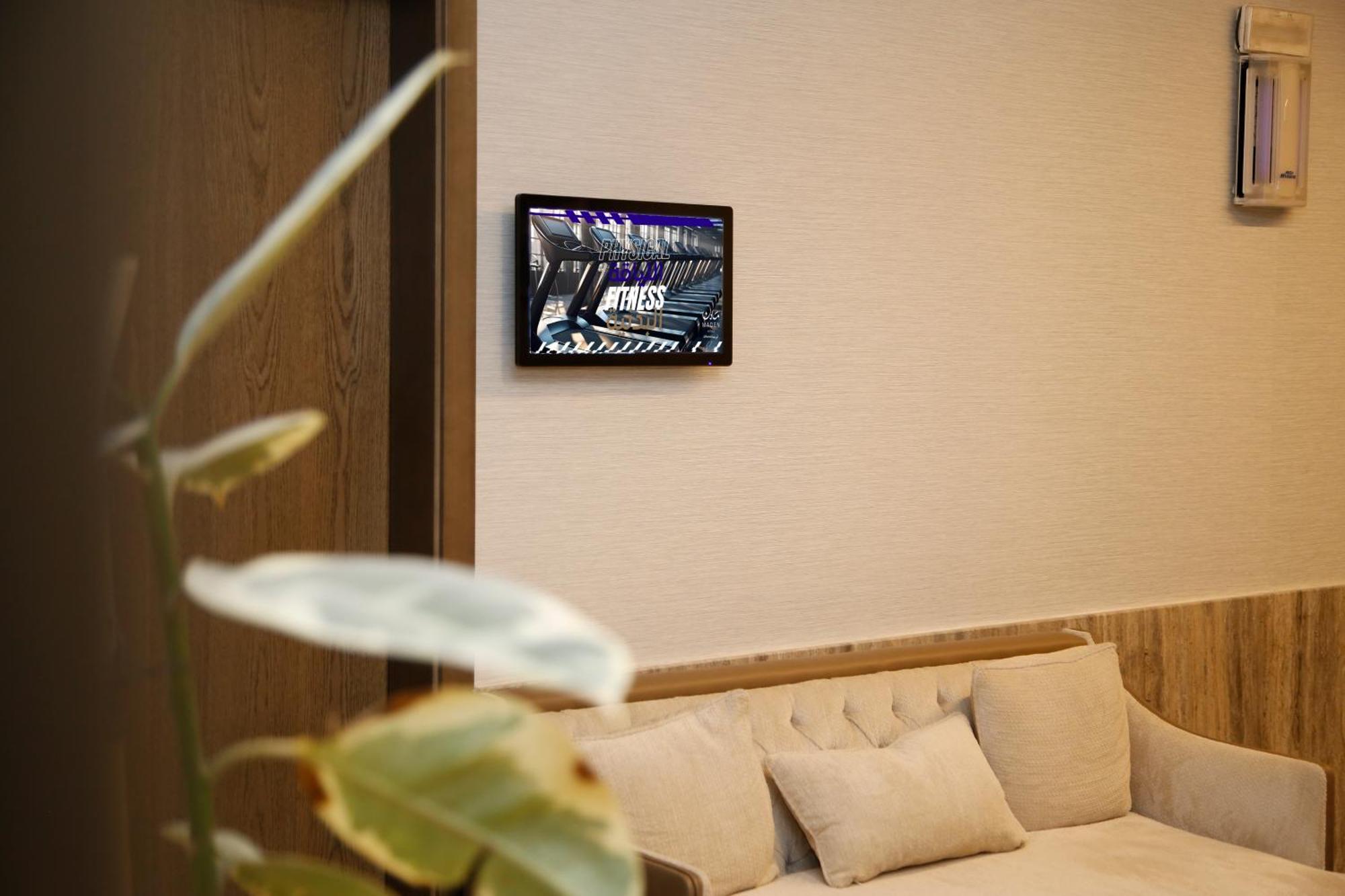 Отель Maden Alrawda Медина Экстерьер фото A wall-mounted tablet
